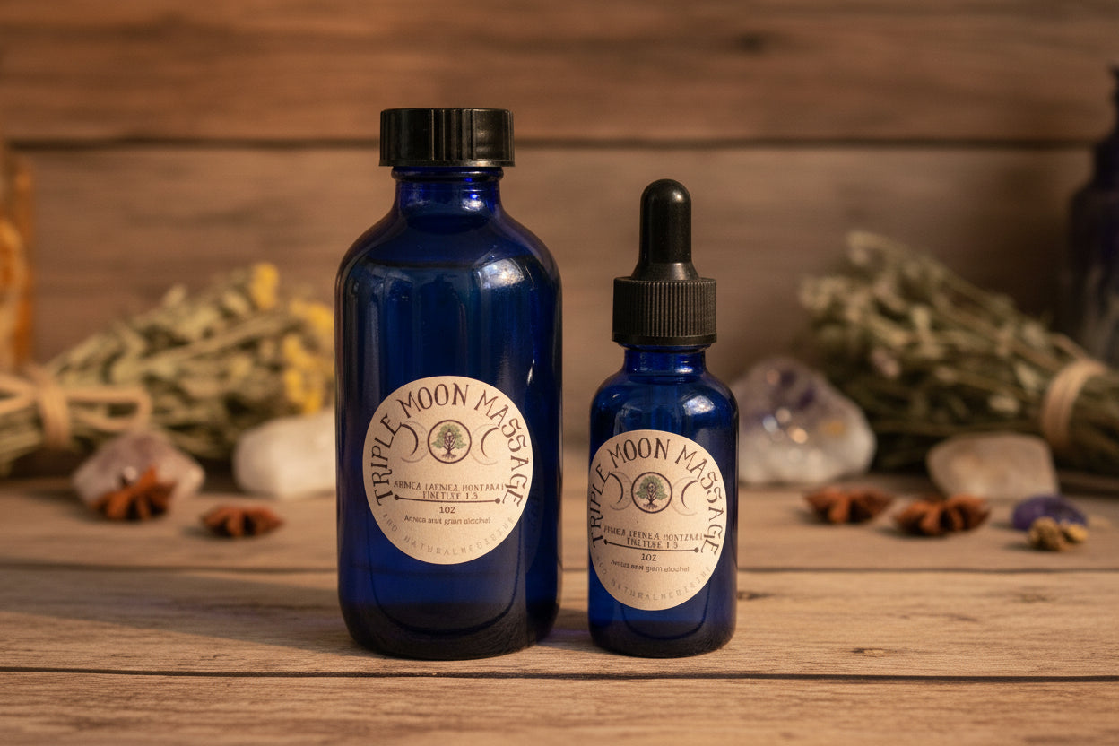 Two blue glass bottles with labels on a green background