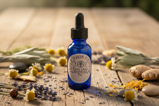 Blue massage oil bottle with a label on a green background